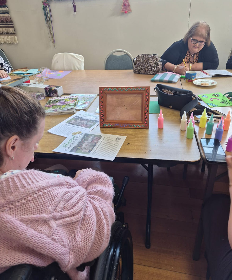 People doing crafts at a table for Palm Sunday