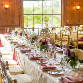 Elegant wedding reception table setting with floral centerpieces