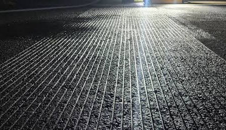 Wet runway pavement at night