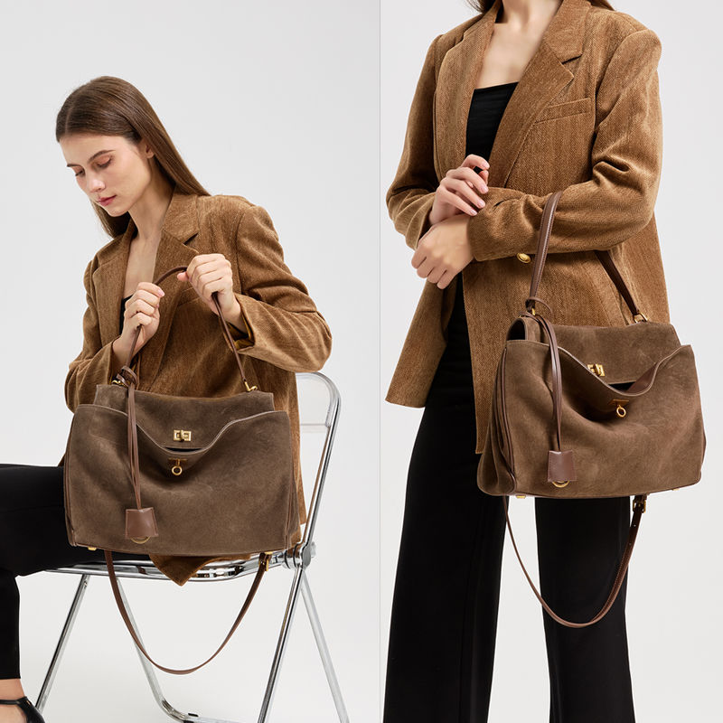 Thumbnail: Chocolate Brown Heritage Suede Leather Tote Bag – Premium Edition displayed by the model.