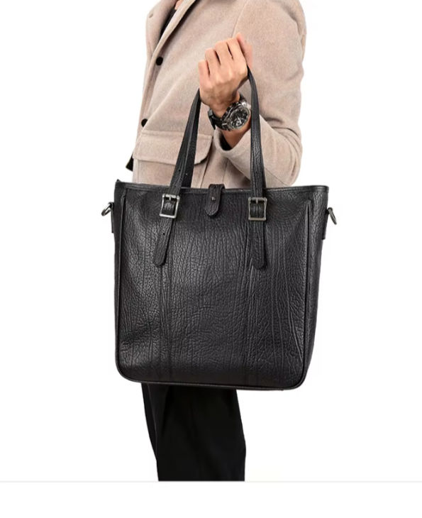 Thumbnail: Black Heritage Leather Tote Bag – Premium Edition carried by the model.