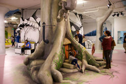 Children playing in giant tree