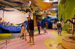 Guests look at exhibits