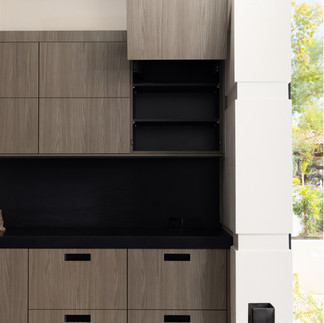 Trendy modern style kitchen with marble countertops and open shelving