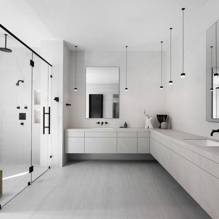 Sophisticated modern grey kitchen with minimalist cabinetry and soft tones.