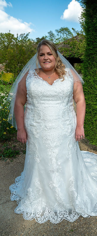 A bride looking at the camera showing new alterations from Cath Adam a wedding dress designer