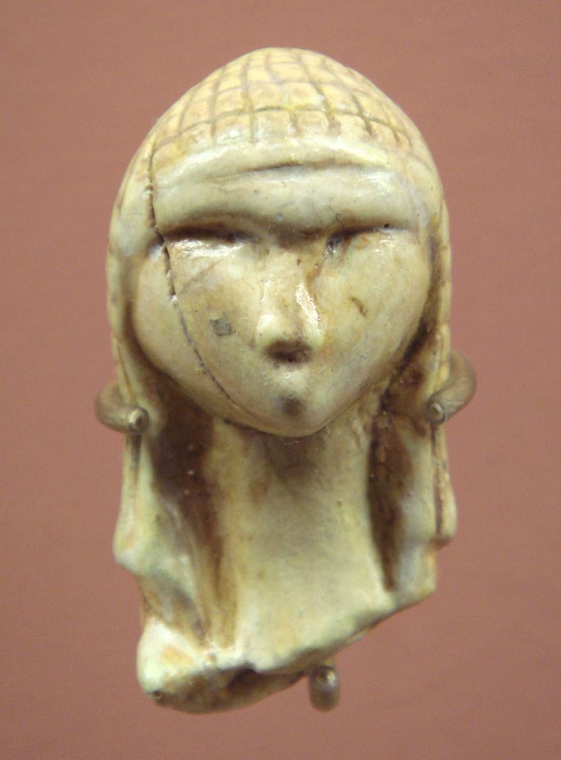 Ivory sculpture of a woman's head.