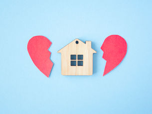 a broken heart either side of a wooden house