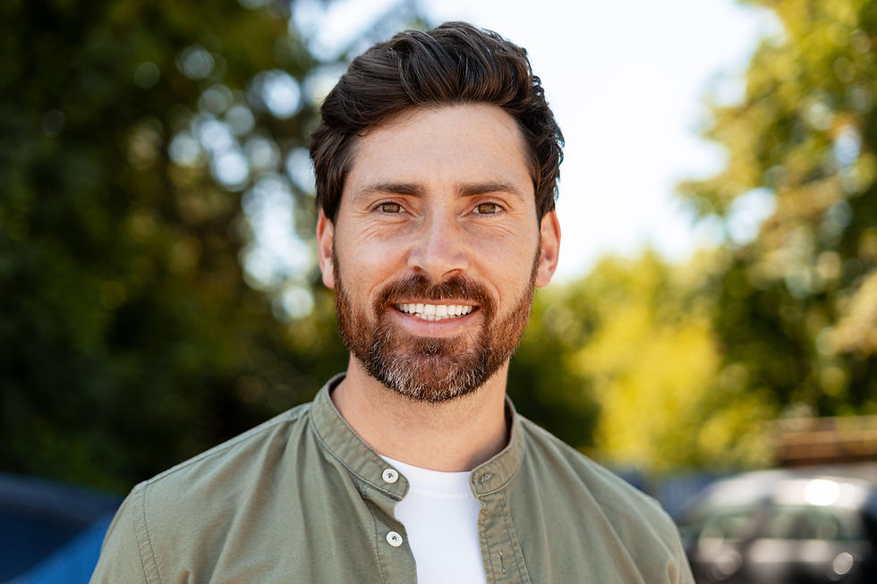 Confident man with restored smile thanks to dental implants