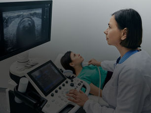 Woman conducting echocardiogram