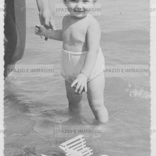 Baby in the sea with little moscone. Italian summertime.
Original vintage print 50s - 60s.
Found photo.