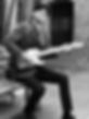 Paul Bytheway playing guitar in Berlin for a video shoot
