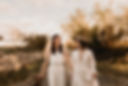 Two girls walking hand in hand at their civil partnership ceremony