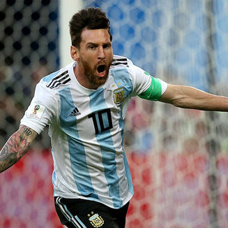 On top of the world: Lionel Messi makes World Cup history as Argentina beat Austria to advance to the knockout stage