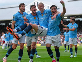 Manchester City players celebrating a goal.
