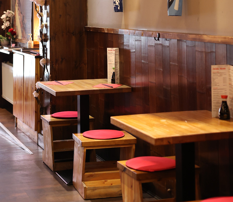 Interior view of Musashi Parnell Japanese restaurant, featuring wooden tables, chairs and lantern decorations.
