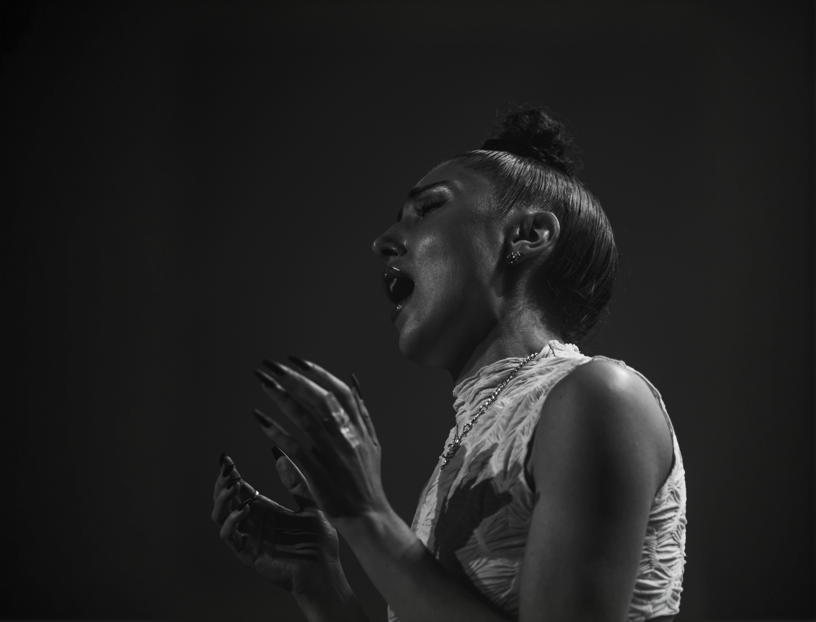 STORRY performing with a microphone