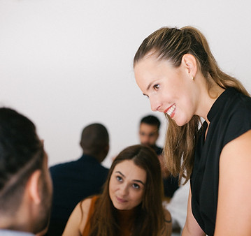 Smile o'clock Close up of Maike working with participants, side profile.jpg