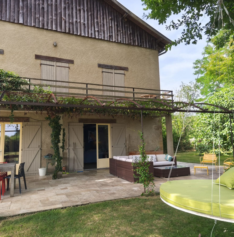 Stone farmhouse holiday gîte for 11 guests near Castelnau-Magnoac, Southwest France with terrace and mature gardens.