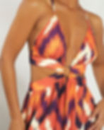 Orange and purple ikat-inspired print on cut-out halter maxi dress – tribal surface design for beachwear, resort fashion, and summer collections.