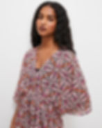 Bold pink and orange swirl geometric print on soft ivory – graphic retro surface pattern perfect for statement resort styles.