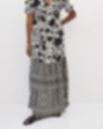 Monochrome black floral and tribal stripe mix on maxi dress – contrast surface pattern play combining florals and geometrics.