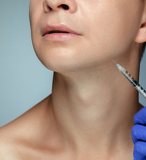 close-up-portrait-young-man-isolated-grey-studio-wall-filling-surgery-procedure.jpg
