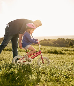 caucasian-man-with-daughter-learning-how-to-ride-b-2022-06-29-00-01-08-utc.jpg