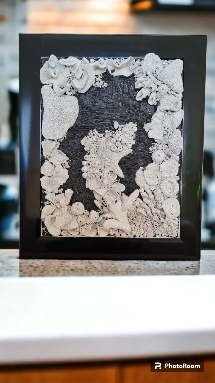 Thumbnail: Black frame and white clay coral reef wall art, ocean theme featuring seashells and corals. Very detailed handmade components