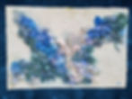 Front of original handmade wall art featuring clay coral reef shapes on a white shimmery background