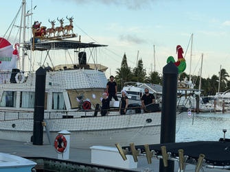 Zero Turbulence relaxing on a boat before their Lighted Boat Parade performance at the Perry Hotel in Key West.