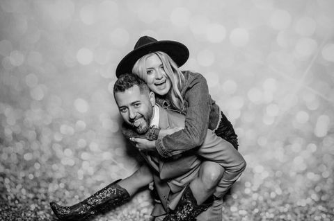 Happy couple piggyback photo booth shot