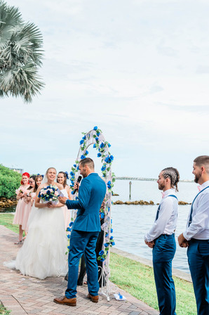 groom reads vows to bride during ceremony at charlotte harbor yacht club