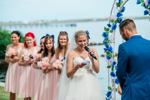 bride reads vows to groom during wedding ceremony at charlotte harbor yacht club