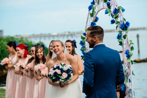 bride shares laugh during wedding ceremony