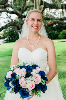 bride with wedding bouquet at charlotte harbor yacht club