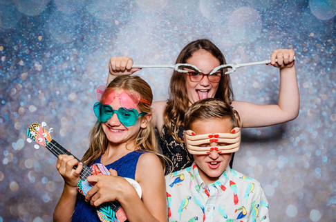 wedding guest having a great time in the photo booth