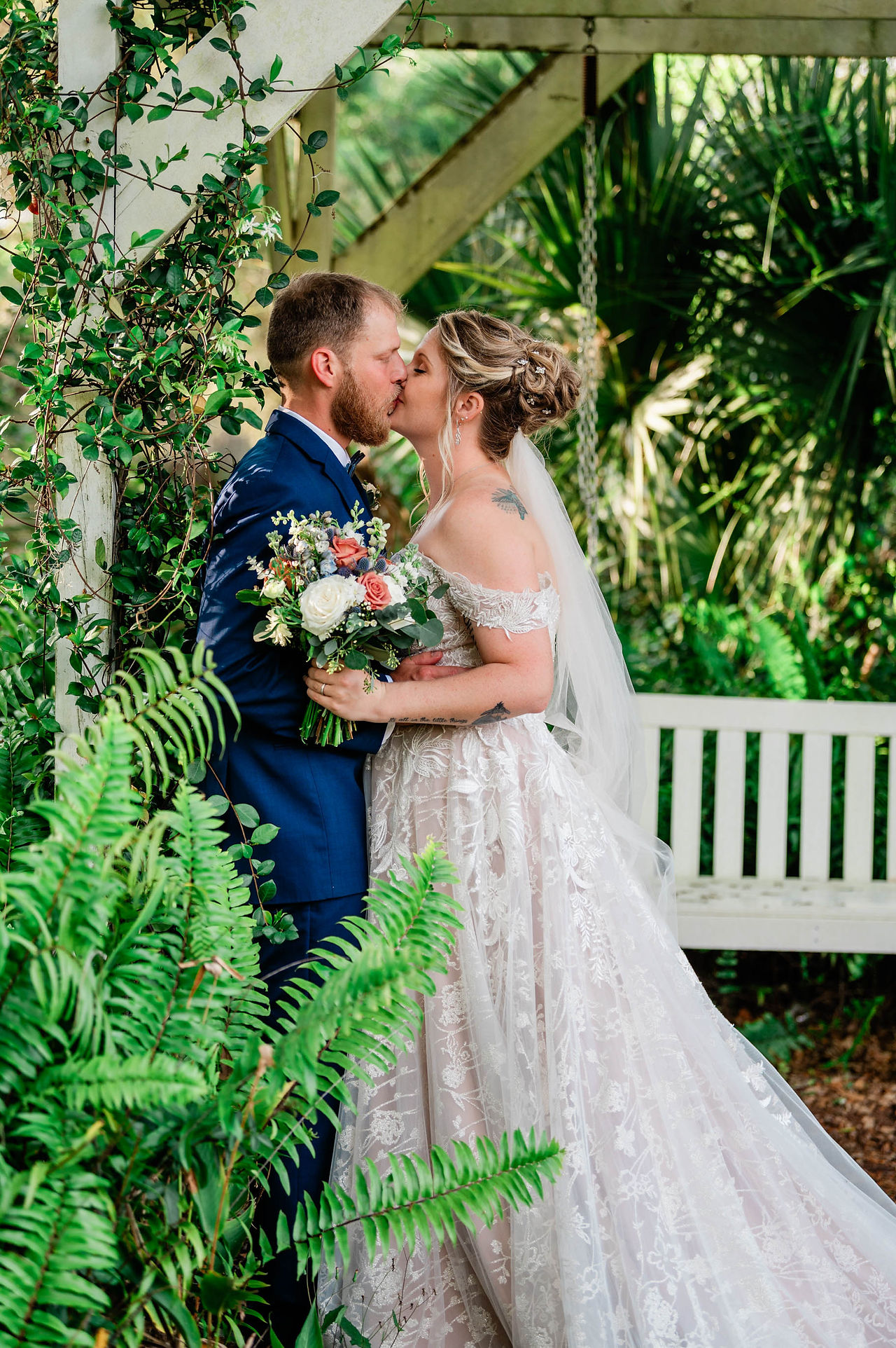 bride and groom share kiss at chapel creek, venice, fl