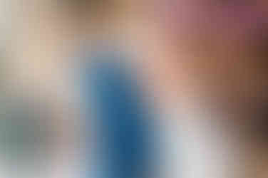 bride and groom getting silly while cutting cake