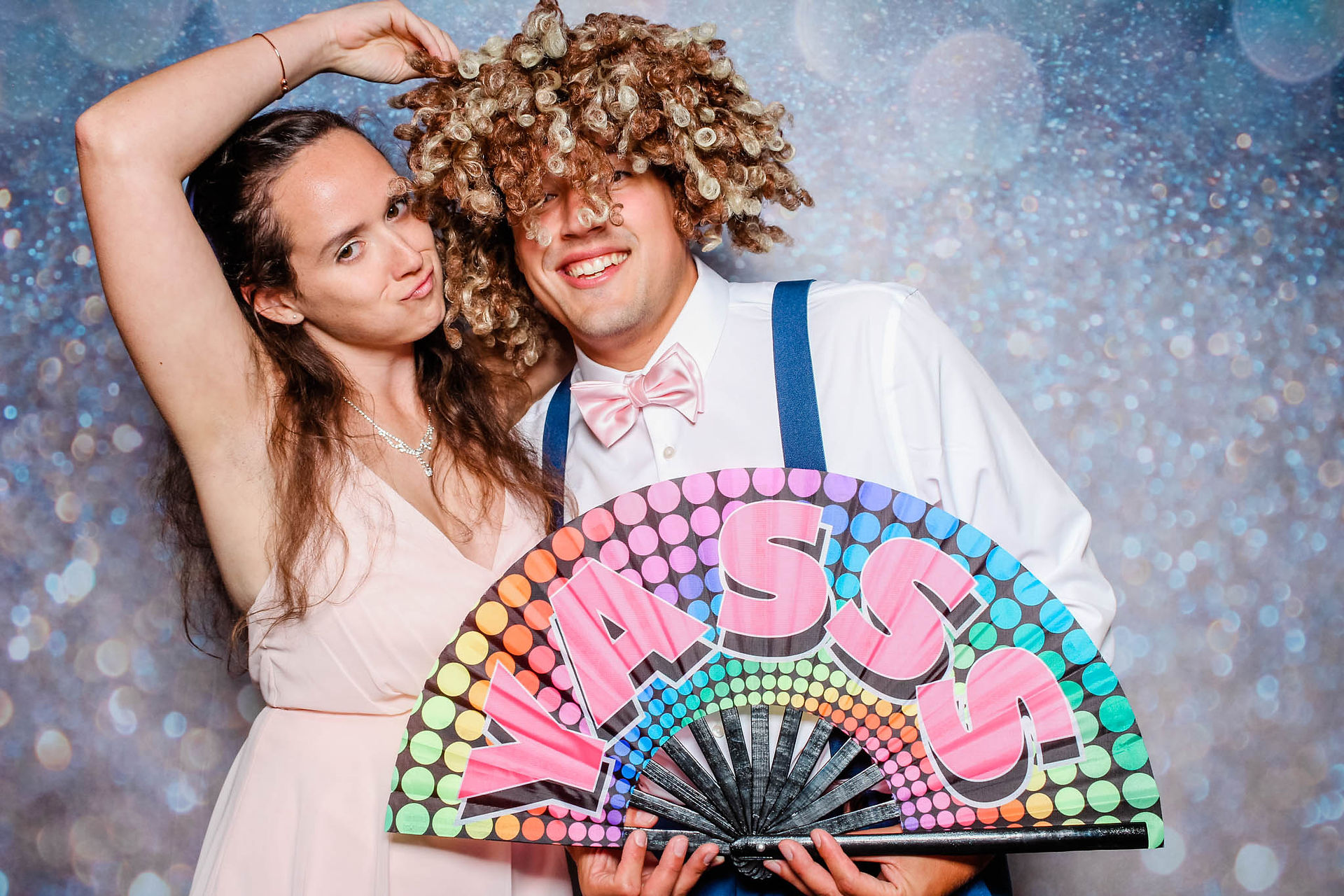 wedding guest having a great time in the photo booth