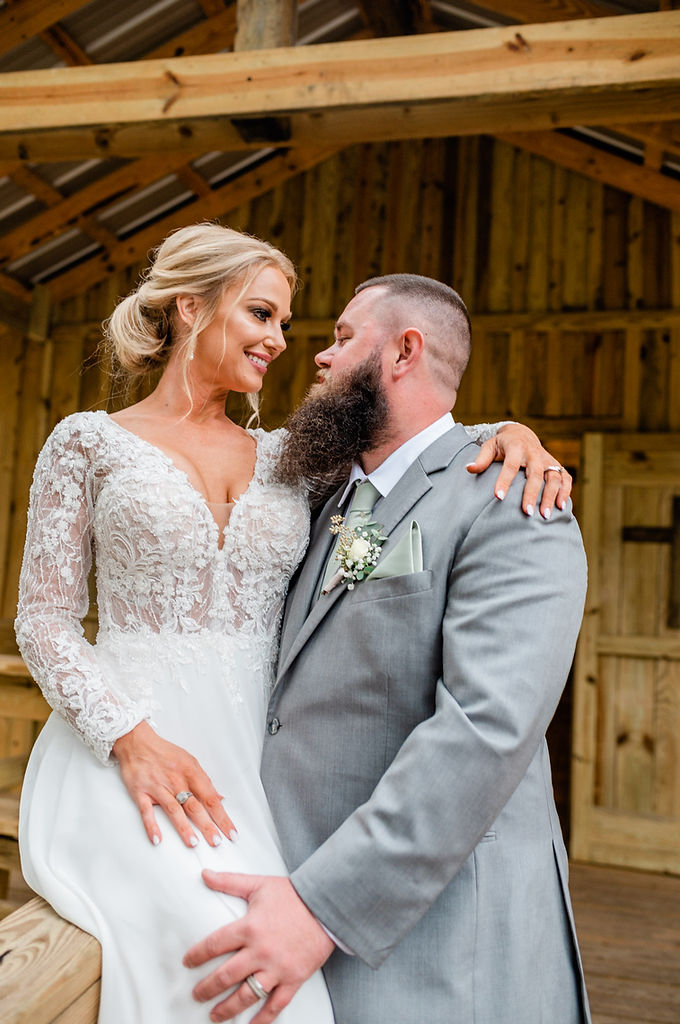 bride and groom pose outside wedding chapel at horse creek camp, ono, florida