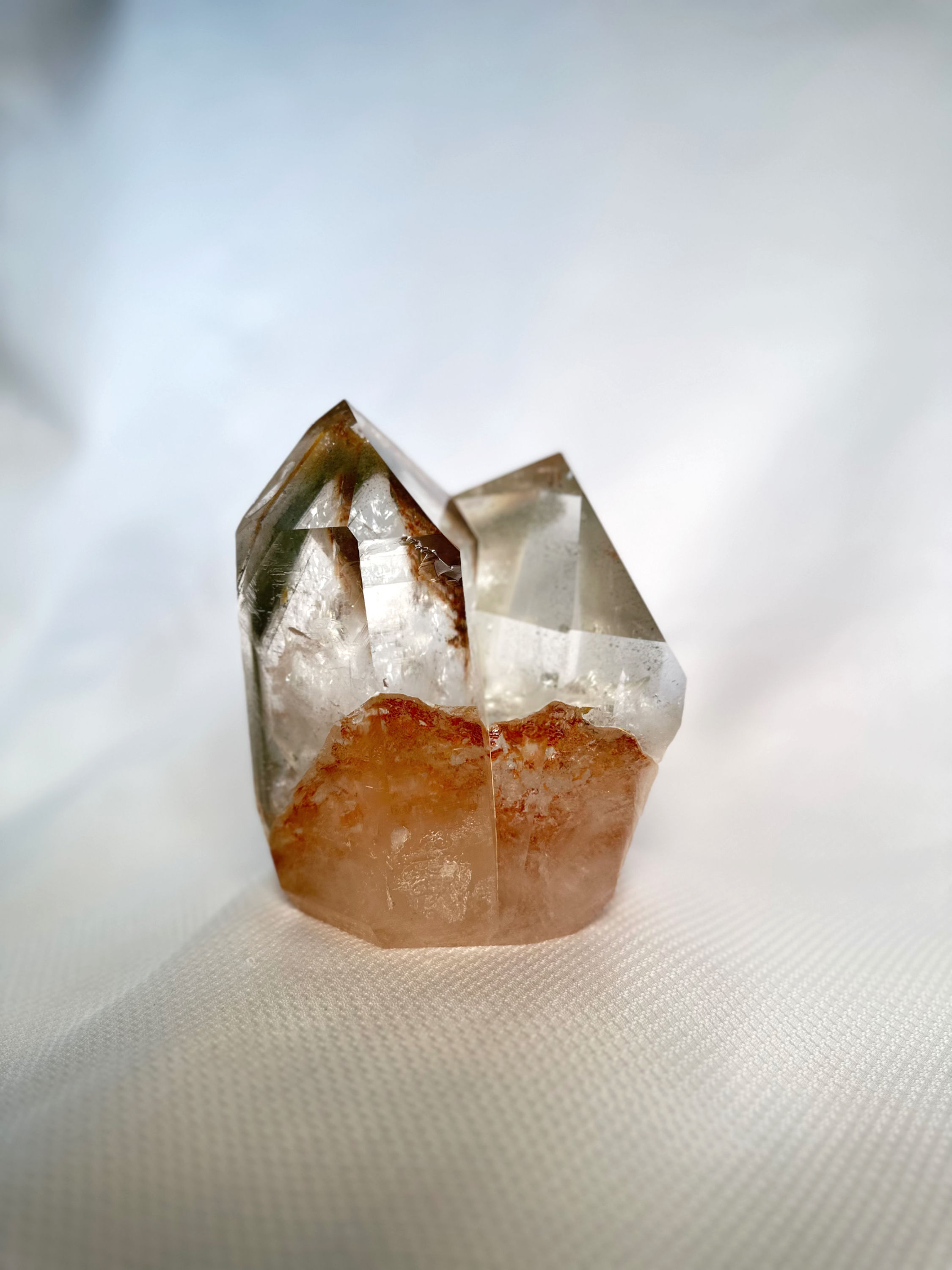 Font side poilshed twin quartz Crystal points with Iron inclusions on the bottom half
