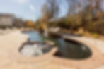 Free form pool with dark finish and spa.