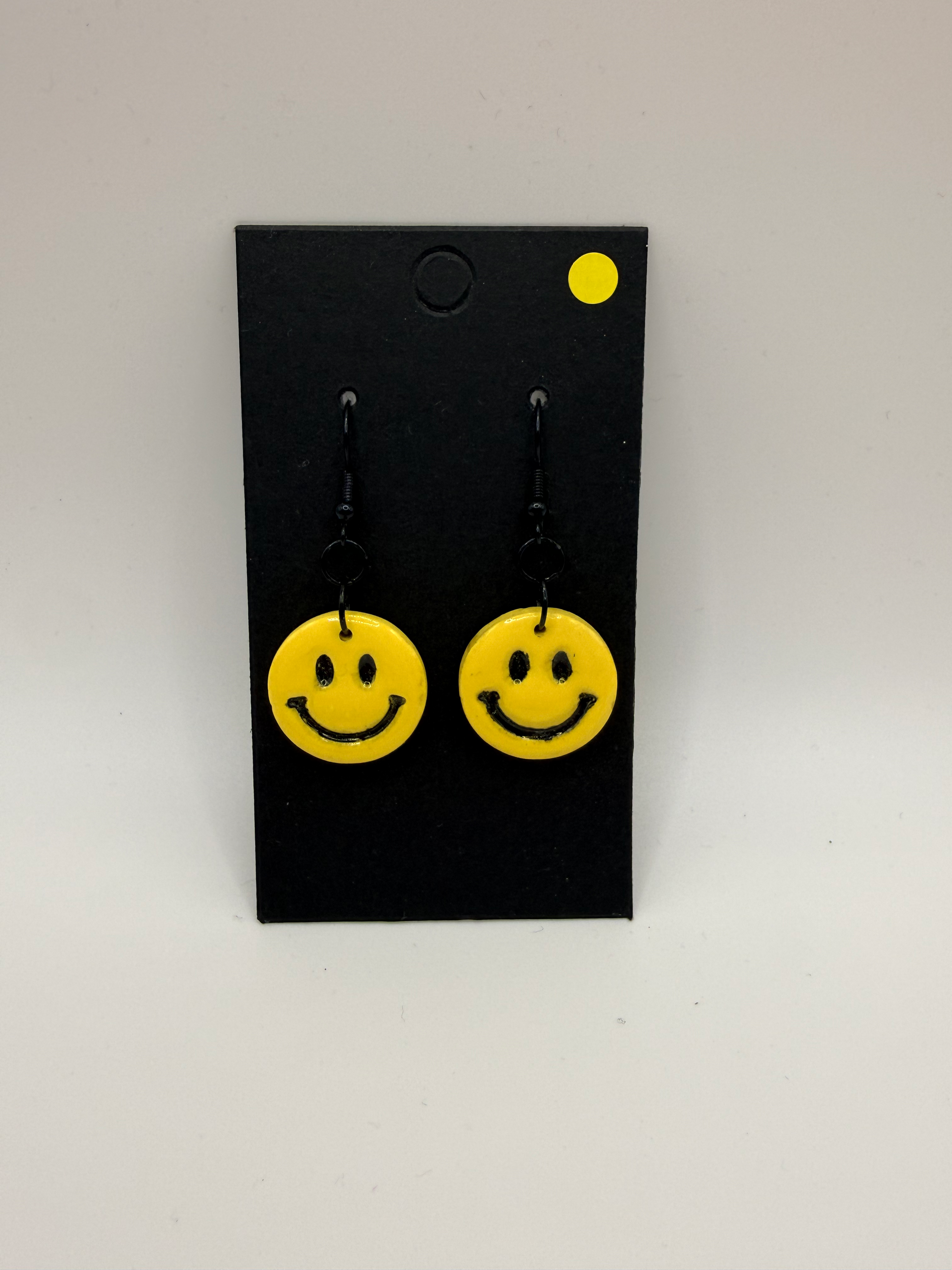 Smiley face dangles