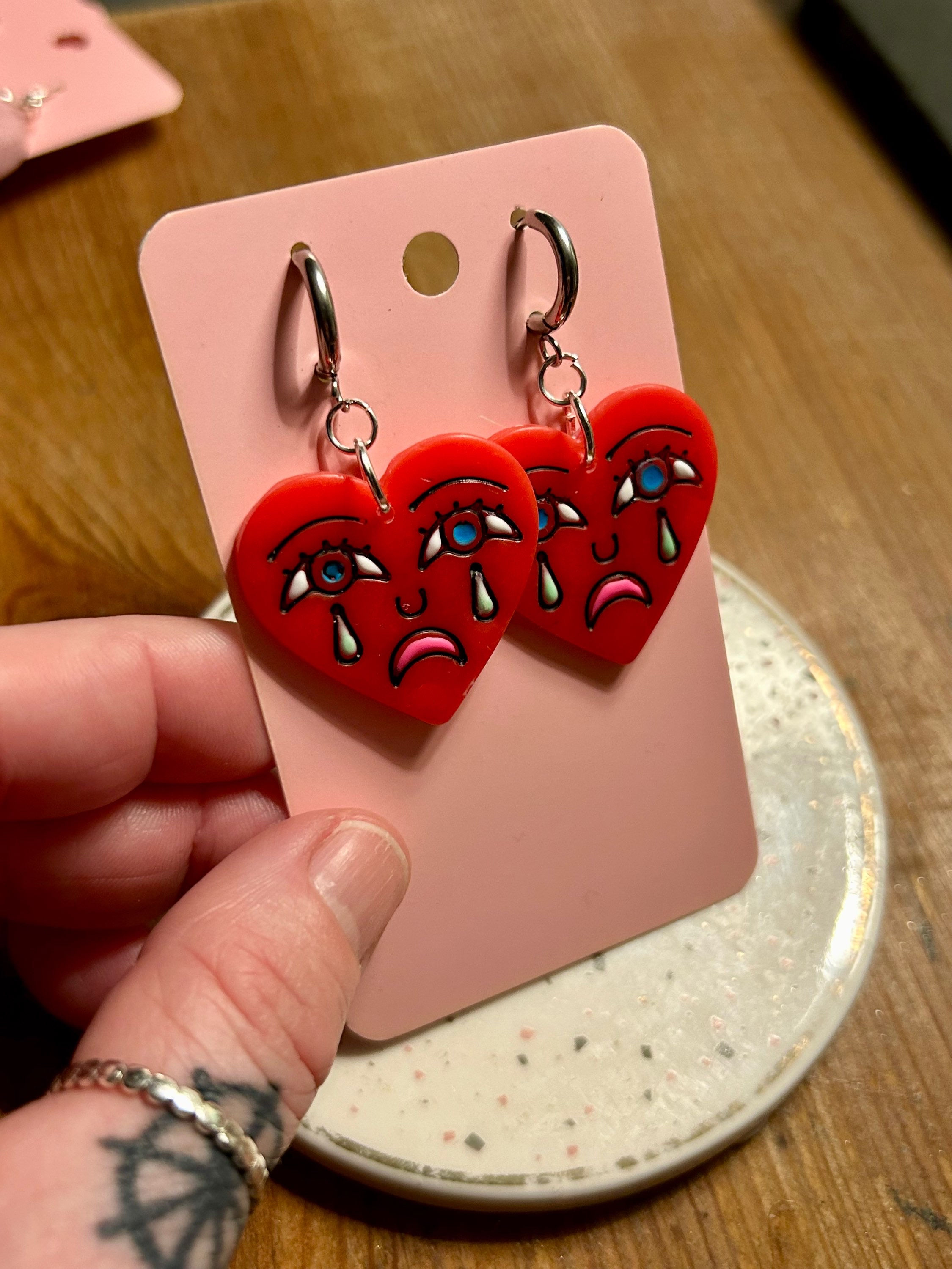 Crying hearts on silver hoops