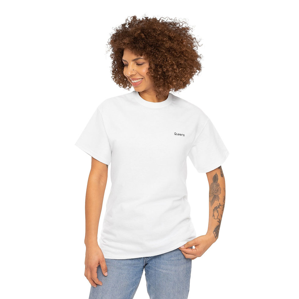 Curly-haired model wearing a white Queens T-Shirt smiling casually