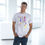 Thumbnail: Male model wearing grey Mix Unisex Deluxe T-Shirt styled with casual jeans.