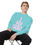 Thumbnail: Man sitting on a chair wearing a mint blue 'I Fly Solo' sweatshirt