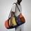 Thumbnail: Colorful floral duffel bag with bold polka dot details.