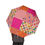 Thumbnail: Person holding a pink patchwork-style semi-automatic umbrella with floral and checkered quilt-inspired patterns